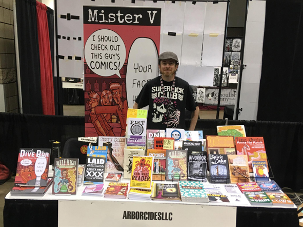 Mister V selling comics at his booth